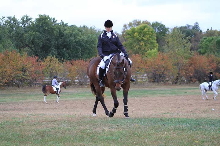 Rider trying to get horse off inside leg